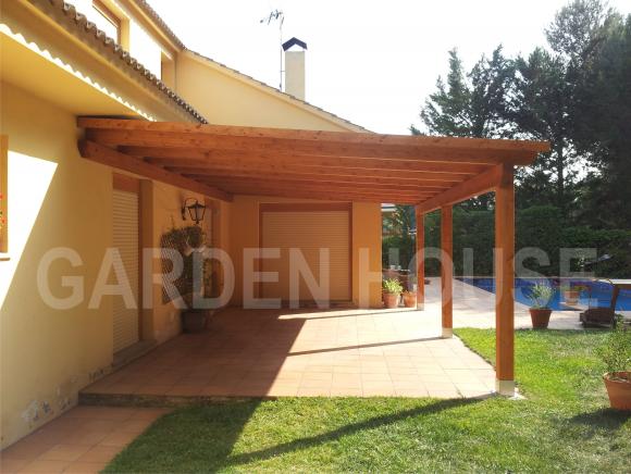 Porche a un agua adosado a la vivienda